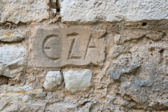 Eza (historic name) written in stone wall in Eze village, French Riviera