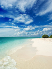 coastline on the coral Atoll. Paradise tropical island, white sand and clear water. Landscape