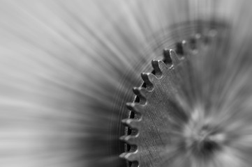 Black and white photography. Metal Cogwheels in clock mechanism , abstract sun beams, Concept Movement is life, Teamwork , Idea Technology, Infinity, Time. Macro