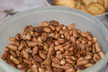 Cup full of hazelnuts picked from the garden.