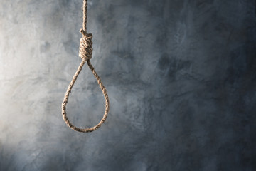 the noose against grunge wall background, failure or commit suicide concept