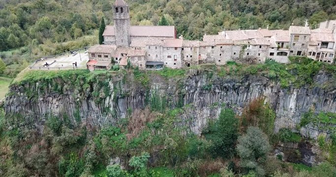Aerial view of Castellfollit de la Roca, medieval Catalan hamlet on cliff on autumn day