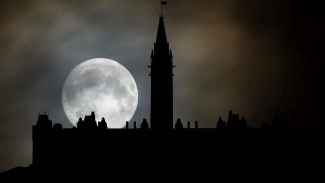 Parliament Hill (Colline du Parlement) and Its Gothic revival suite of Buildings in Silhouette by Night With Full Moon, Ottawa, Ontario, Canada