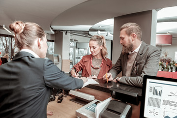 Attentive young man checking information on agreement