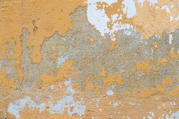 Crumbling, cracked  paint on old house wall close up shot, image for background.