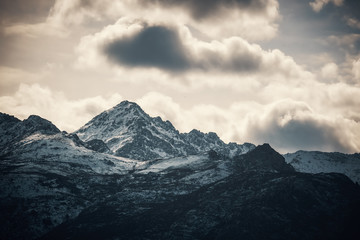 Snow capped peak of Monte San Parteo mountain in Corsica
