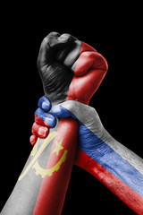 Russia VS Angola, Fist painted in colors of Angola flag, fist flag, country of Angola