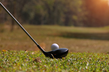 Golf club and golf ball close up in golf coures at Thailand
