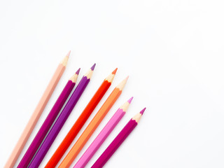 Fototapeta premium Multicolored pencils with free space for text on white background, Color pencils isolated