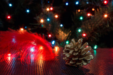 Christmas background, garland lights, bump, toys, glare night. New Year's toys and ornaments background theme.