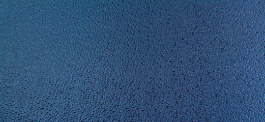 Beautiful, abstract, bright, colored surface of the plaster wall as a background and texture. Possible to use as a stylized surface with space for text