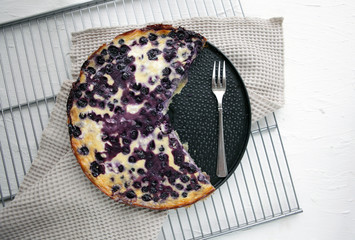 Bluberry homemade pie on a white backdrop and metallic base