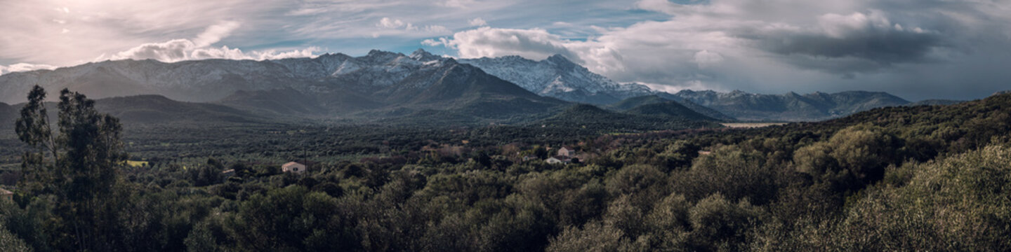 Panoramic view of snow capped mountains in Corsica