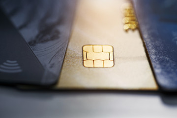 Selective focus microchip on paying by credit card or credit gold card for background. Contactless...