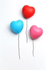 Fototapeta na wymiar color rubber hearts balloons creative photography isolated on white background,Valentine's Day concept