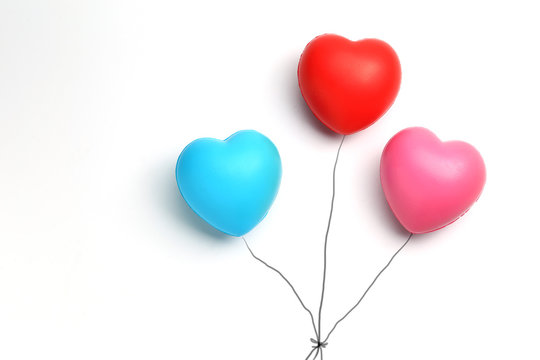 color rubber hearts balloons creative photography isolated on white background,Valentine's Day concept