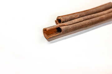 Top view of cinnamon sticks isolated on white. Fragrant cinnamon sticks