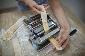 Housewife makes noodles with a special device. New generation