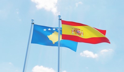 Spain and Kosovo, two flags waving against blue sky. 3d image