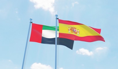 Spain and UAE, two flags waving against blue sky. 3d image