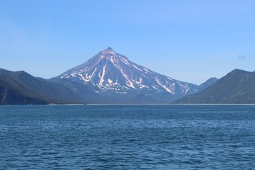 View of Vilyuchinsky volcano (also called Vilyuchik) from tourist boat. It's a stratovolcano in the southern part of Kamchatka Peninsula, Russia.