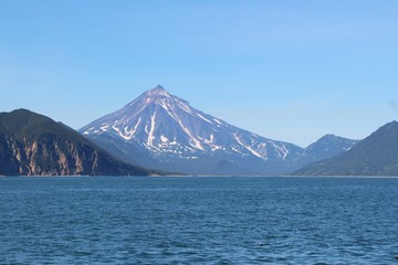 View of Vilyuchinsky volcano (also called Vilyuchik) from tourist boat. It's a stratovolcano in the southern part of Kamchatka Peninsula, Russia.