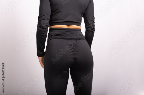 Close Up Of Sportive Woman Wearing Sexy Leggings Rear View Of Sexual Sporty  Buttocks Wearing Black Tight Pants Leggings Copyplace, Copy Space Isolated  On White Background Wall Mural-Marharyta