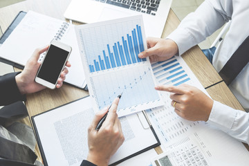 Startup Teamwork Brainstorming Meeting with Graph Planning strategy and financial plan to...
