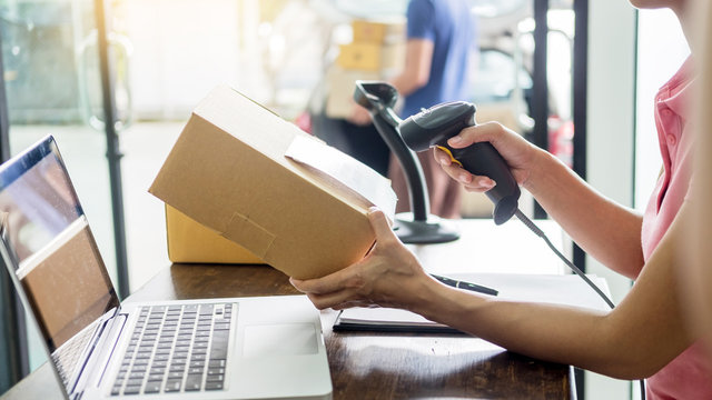 Courier Hands Business Woman Work At Home Office Checking Parcel Package Box By Keying Machine Track Tools Before Ship And Documents Data