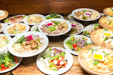 many plates of food on the holiday table