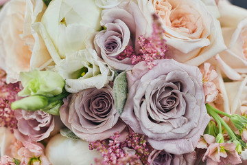 beautiful wedding bouquet with roses standing on the table