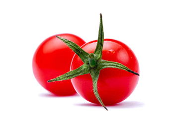 Ripe, fresh cherry tomatoes isolated on white background