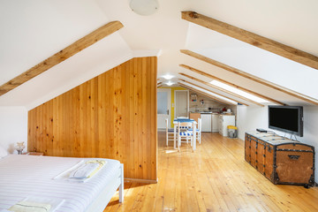 Interior of a cozy studio in light colors in a private house