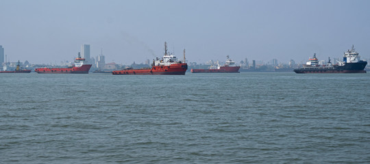 Commercial shipping at anchor in the Arabian Sea off the coast of Mumbai, India, which is the busiest port in South Asia 
