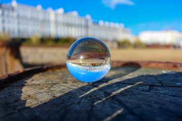 Victorian buildings through a glass orb
