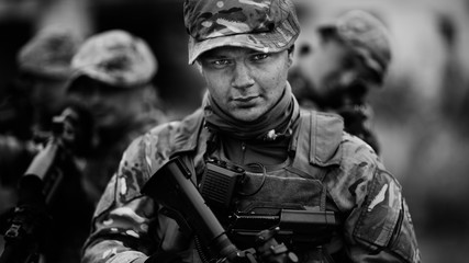 Army sniper during the military operation in the city. war, army, technology and people concept.