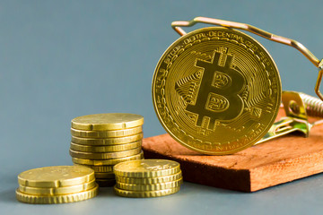 Coin bitcoin in  mousetrap.