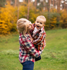 Family on weekend. Mother father and son in park