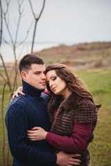 Close up of romantic attractive young couple hugging