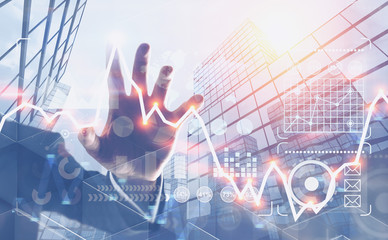 Man hand using graph and infographics in city