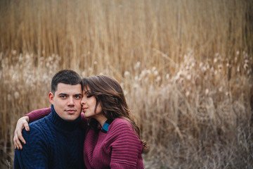 Close up of romantic attractive young couple hugging outdoors