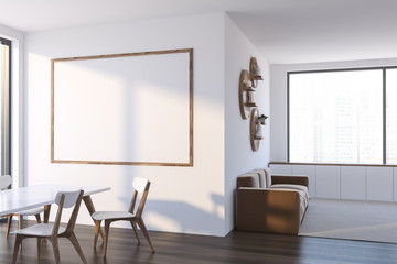 White stylish dining room with poster and sofa