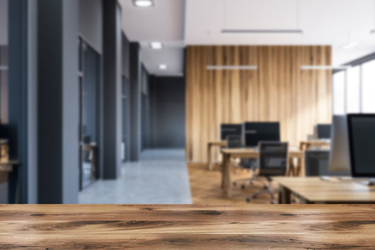 Wooden and gray open space office blur
