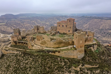 Aerial view of the ruined medieval abandoned Montearagon castle, namesake of the famous kingdom on...