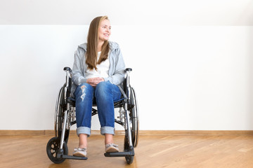 Invalid girl sitting in wheelchair.