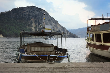 Water taxi at the pier in the sea bay.