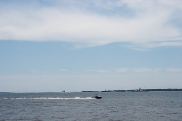 On a sunny day, yachts are sailing in the ocean. Charleston, South Carolina / USA - July 21, 2018