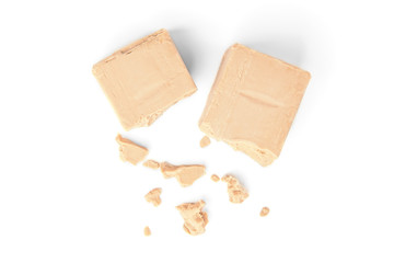 Pressed yeast isolated on white background.