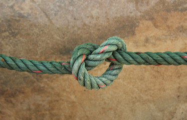 Fototapeta na wymiar Green Nylon rope. Isolated on black background.