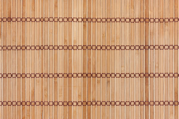Beige bamboo mat with dark threads. Texture for background and design.